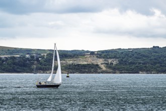 Boats over Hurst Point Lighthouse and Hurst Castle, Hurst Spit, Milford on Sea, Lymington,