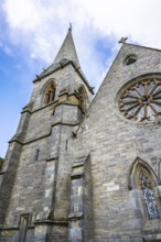 Church and cemetery over Borthwick Castle, Midlothian, Scotland, UK