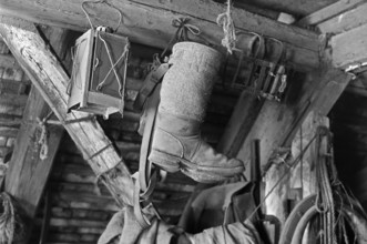 Old stable lantern and felt boots on a former Franconian farm, black and white, Bavaria, Germany