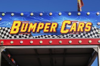 Close-up of Bumper Cars amusement ride banner at Fun Show traveling amusement ride park, Old Port