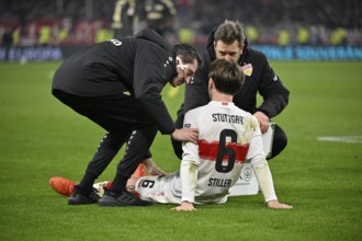 Club doctor Dr Dr Heiko Striegel VfB Stuttgart and carers look after Angelo Stiller VfB Stuttgart
