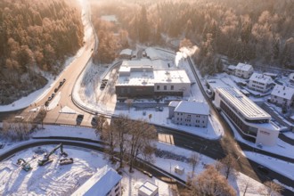 Snowy factories and roads near a forest area in winter time, Nagold, Calw district, Black Forest,
