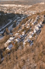 Snowy houses in a row along a hill with a wintry atmosphere, Nagold, Calw district, Black Forest,