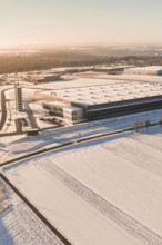Industrial area in snow at sunset with large buildings and open sky, Nagold, Calw district, Black