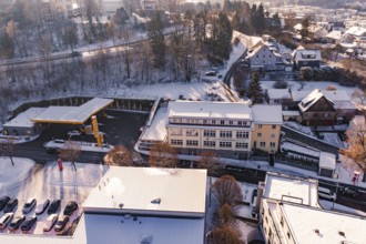 Snow-covered city view with modern buildings and roads in a wintry atmosphere, Nagold, Calw