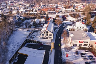 Snowy town with modern architecture, surrounding cars and roads, Nagold, Calw district, Black