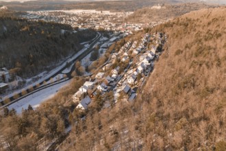 Snowy winter landscape of a village on the edge of a hill, surrounded by forest, Nagold, Calw