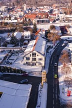 Snowy city view with clear road and buildings, Nagold, Calw district, Black Forest, Germany