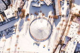 Aerial view of a snowy area surrounded by buildings, Celtic Tomb, Nagold, Calw district, Black