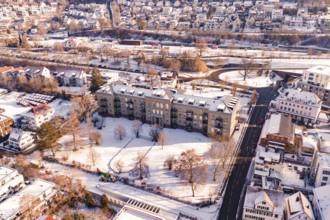 Snow-covered town with large buildings and a main road, Nagold, Calw district, Black Forest,