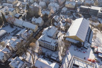Snowy districts with dense buildings and trees from a bird's eye view, Nagold, Calw district, Black