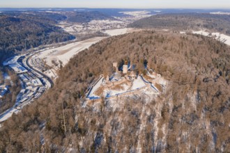 Aerial view of a snowy castle on a wooded hill, Nagold, Calw district, Black Forest, Germany