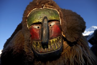 Portrait of traditional hand-carved wooden mask from the Loetschental Carnival, representing
