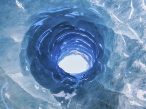 Hole in an ice cave, formed by melting and subglacial streams, Climate Change, Global Warming,
