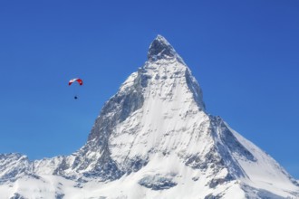 Winter paragliding near the Matterhorn, Zermatt, Valais, Switzerland
