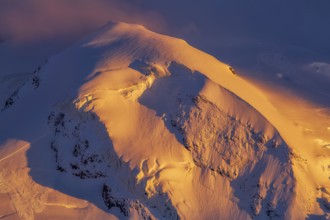 Pollux (4, 092?m -13, 425?ft) at sunset in winter, a peak in the Pennine Alps on the border between