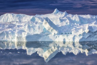Icebergs calved from the Jakobshavn Isbræ (Sermeq Kujalleq) glacier floating in Disko Bay, the