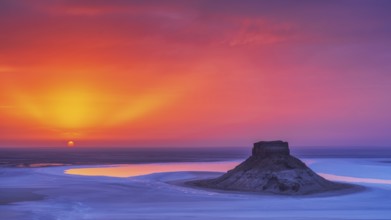 Sunset at Karynzharyk Depression with Mount Karamaya rising above the salt plain, unique saline