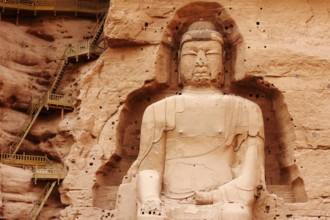 Along the Yellow River, a series of grottoes filled with Buddhist sculptures, including the giant
