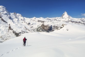 Snowshoeing in the Gornergrat region with views of the surrounding mountains and the Matterhorn,