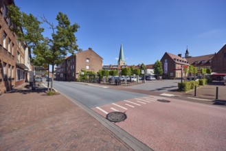 Residential building, brick building, general architecture, church tower of St. Remigius, sidewalk,