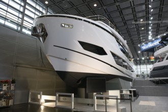 Press photo View of luxury yacht luxurious motor yacht Sunseeker yacht in exhibition hall of Messe
