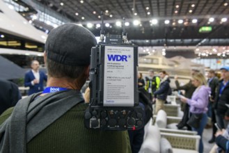 Press photo Cameraman from Westdeutscher Rundfunk WDR producing coverage by Messe Boot, Düsseldorf,