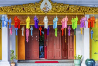 Decorated entrance to Wat Yannawa Buddhist temple decorated with colored lanterns, Bangkok,