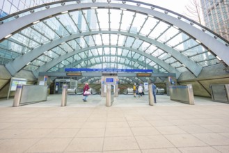 A modern building entrance with a glass roof and deserted escalators, London, England, Great
