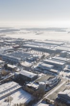 Snowy industrial area in Europe with numerous buildings and clear skies, Wolfsberg industrial area,