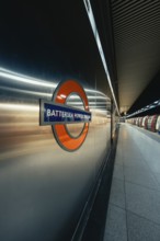 Close-up of Battersea Power Station sign in a modern subway station, London, United Kingdom