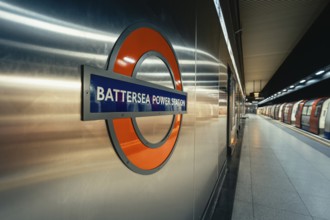 View of the Battersea Power Station subway sign on the wall in a modern train station area, London,
