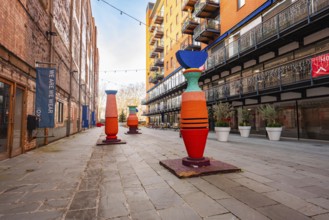Colourful art installations in an urban courtyard with buildings, London, England, Great Britain