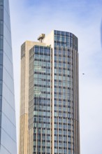 A modern high-rise building with glass façade stretches skyward, London, England, Great Britain