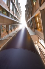 A central upward view along a modern architectural pillar, London, England, Great Britain