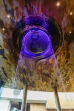 Artificial, brightly lit waterfall, Magic Waterfall, falls from the ceiling of the Iconsiam