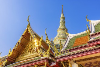 The Grand Royal Palace, Wat Phra Kaeo Buddhist Temple, overlapping roofs with curved chofas, Chedi