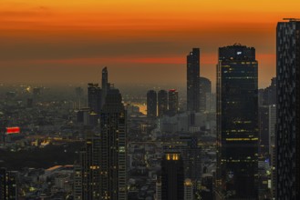 Over the rooftops of Bangkok, sunset, view from the Moon Bar on the roof terrace of the Banyan Tree