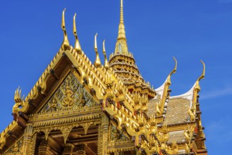 The Grand Royal Palace, the gilded Abhorn Bimok Pavilion with overlapping roofs and curved chofas,