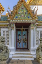 The Grand Royal Palace, side entrance of Raja Karanyasabha Hall with carved doors, Phra Nakhon,