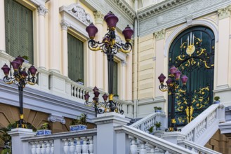 The Grand Royal Palace, side entrance with decorated gate and multi-armed lanterns, Chakri Maha