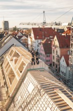 Craftsmen posing on the roof top of a new building in an urban environment, carpentry, renovation,