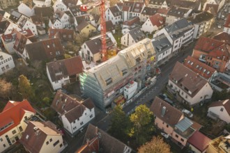 District with a large construction site in the center, taken from above, carpentry, renovation,