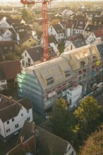 Panoramic view of a construction site in a residential area doing roofing work in an urban