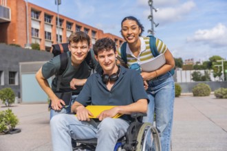 Happy young students, including a person using a wheelchair, standing together on a university
