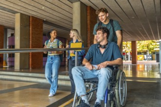 Diverse group of young adult university students walking and talking on campus, with one male