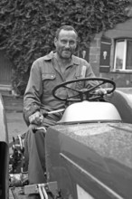 Farmer on his Schlüter tractor, black and white, Tauchersreuth, Middle Franconia, Bavaria, Germany