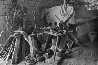 Tool shed with tool bench on a former Franconian farm, black and white, Franconia, Bavaria, Germany