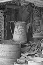 Chains, old coffee pot and collected utensils in an old cupboard on a farm, Middle Franconia,