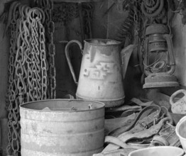 Chains, old coffee pot and collected utensils in an old cupboard on a farm, Middle Franconia,